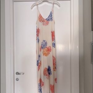 White floral maxi with adjustable straps. Size S/M